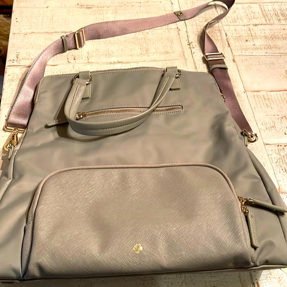 Samsonite convertible tote backpack.  Used once.  Beautiful.  5 ways to wear it